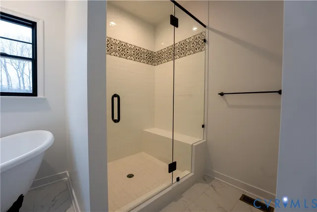 a bathroom with a shower and a sink