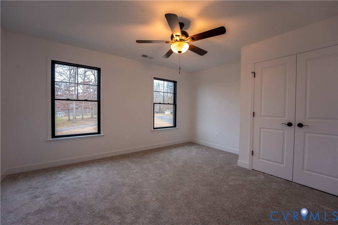 5512 Hickory Ridge Road Spotsylvania, VA 22551 - Photo 20 of 22 an empty room with windows and fan