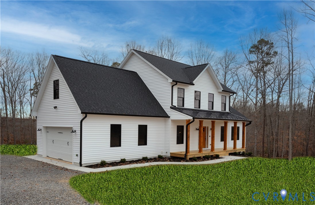 5512 Hickory Ridge Road Spotsylvania, VA 22551 - Photo 2 of 22 a front view of a house with a yard and garage