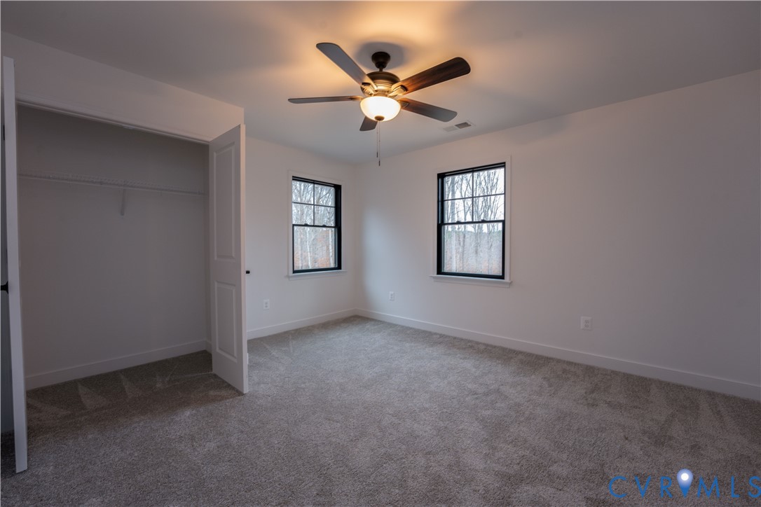 5512 Hickory Ridge Road Spotsylvania, VA 22551 - Photo 21 of 22 an empty room with window and ceiling fan
