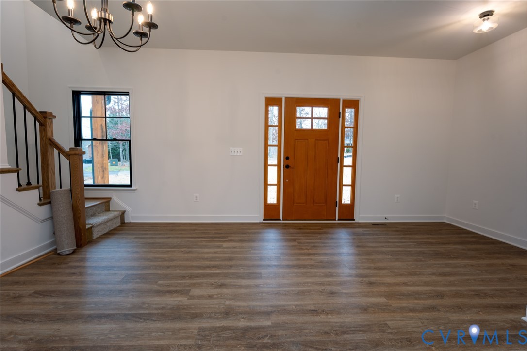 5512 Hickory Ridge Road Spotsylvania, VA 22551 - Photo 4 of 22 a view of an empty room with window and wooden floor