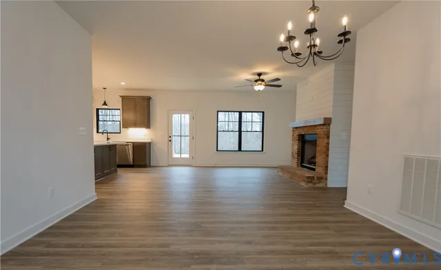 a view of livingroom and kitchen with wooden floor
