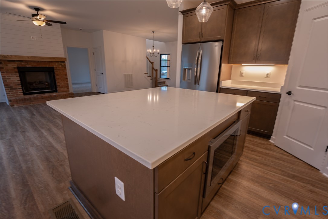5512 Hickory Ridge Road Spotsylvania, VA 22551 - Photo 7 of 22 a close view of a refrigerator a stove a sink and dishwasher with wooden floor