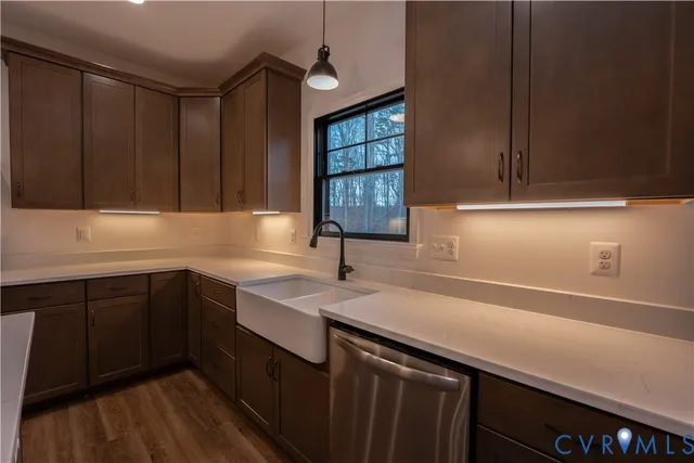 a kitchen with a sink and cabinets