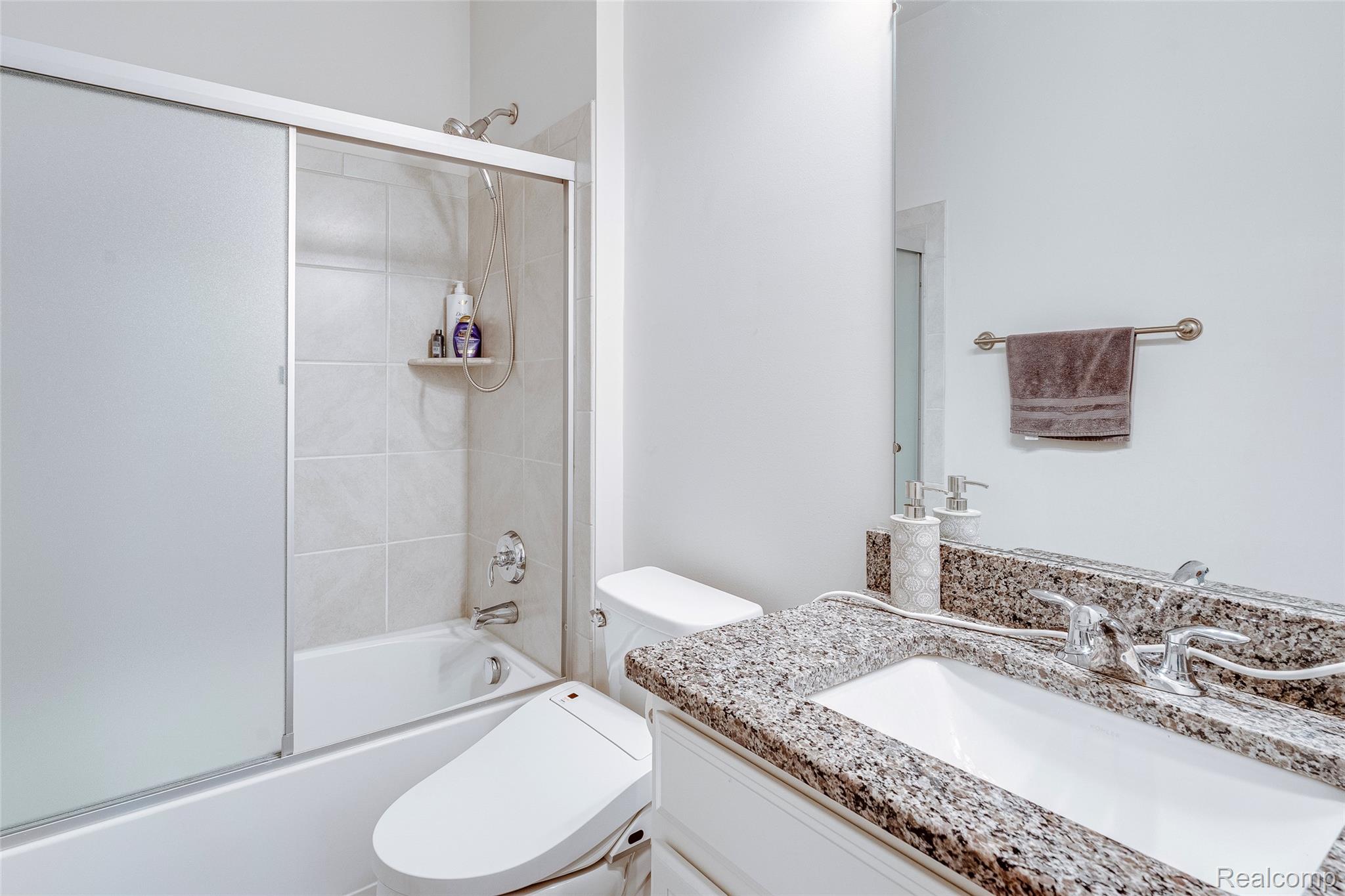 51011 Rockingham Drive Canton, MI 48188 - Photo 44 of 74 Full bathroom featuring shower / bath combination with glass door and vanity