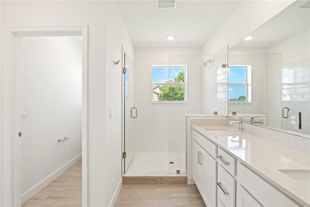 5653 Stradella Drive Boca Raton, FL 33433 - Photo 7 of 26 a bathroom with a granite countertop sink mirror and a bathtub