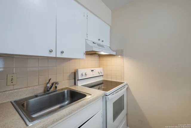 a view of storage and utility room with washer and dryer