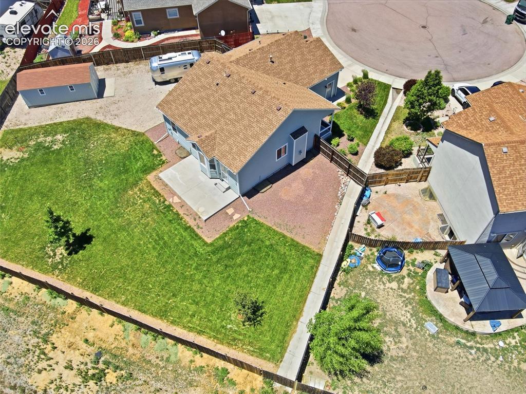 7806 Dutch Loop Colorado Springs, CO 80925 - Photo 38 of 41 an aerial view of a house with garden space and street view
