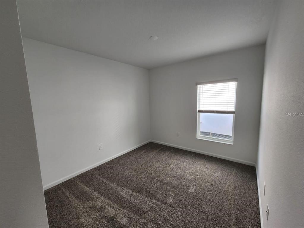 2713 Runners Circle Clermont, FL 34714 - Photo 16 of 30 an empty room with a window