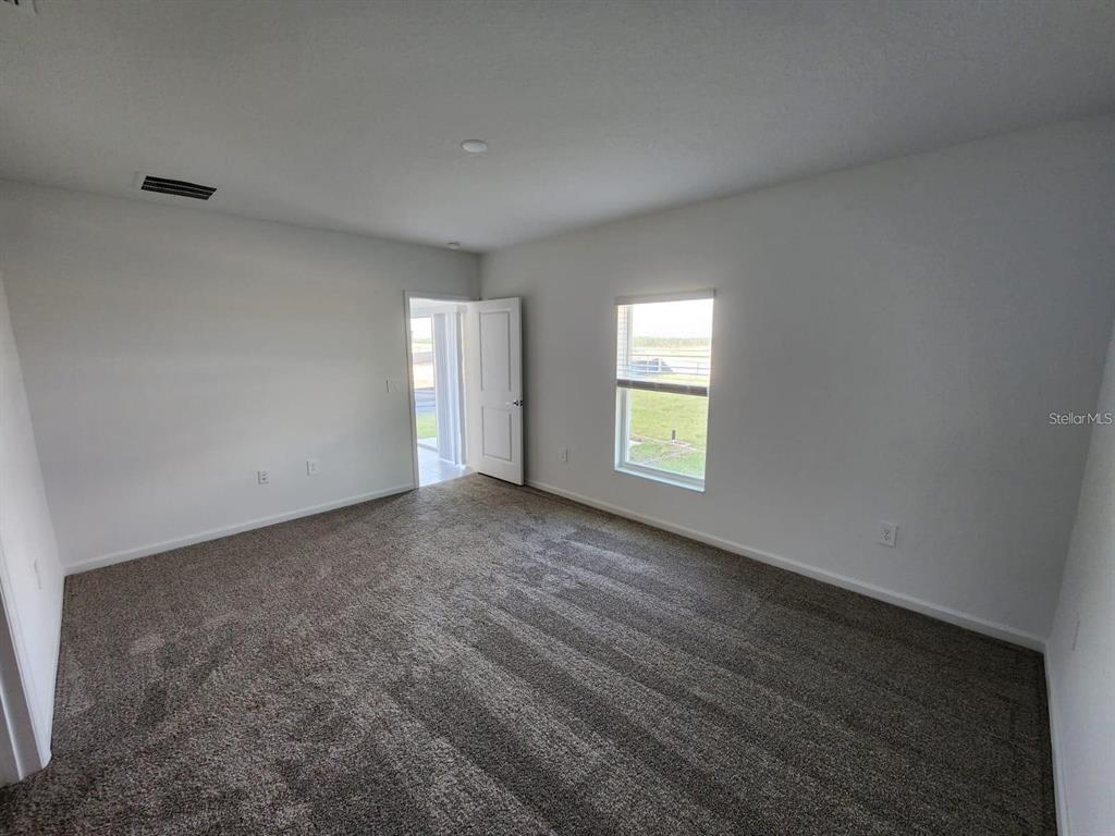 2713 Runners Circle Clermont, FL 34714 - Photo 24 of 30 a view of empty room with window