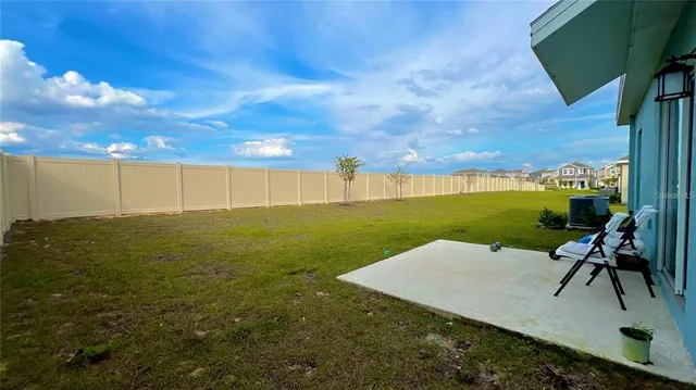 a view of a lake with a big yard