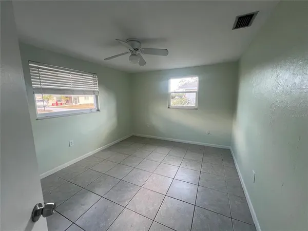 a view of an empty room with a window