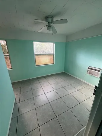 a view of an empty room with a window