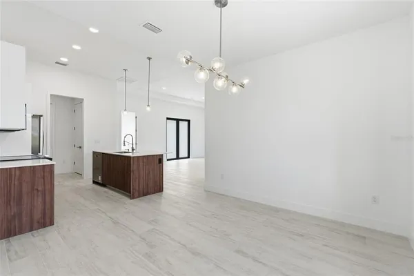 a bathroom with a sink a toilet a shower and a mirror