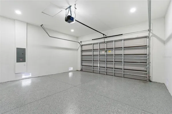 an aerial view of residential house with outdoor space and swimming pool