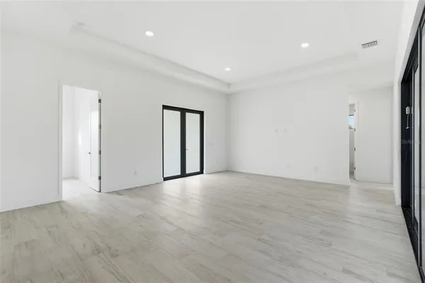 a kitchen with a sink a counter top space stainless steel appliances and a center island