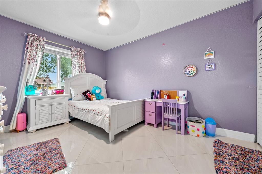 1041 Southwest General Patton Terrace Port St. Lucie, FL 34953 - Photo 21 of 39 a living room with furniture and a window