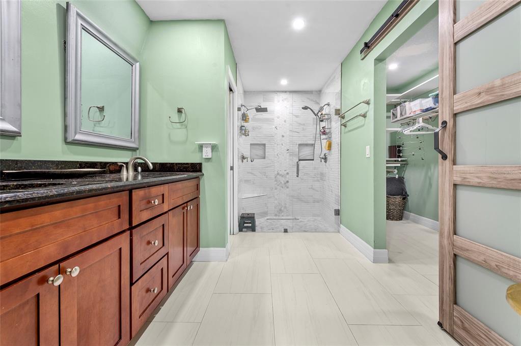 1041 Southwest General Patton Terrace Port St. Lucie, FL 34953 - Photo 23 of 39 a bathroom with a shower