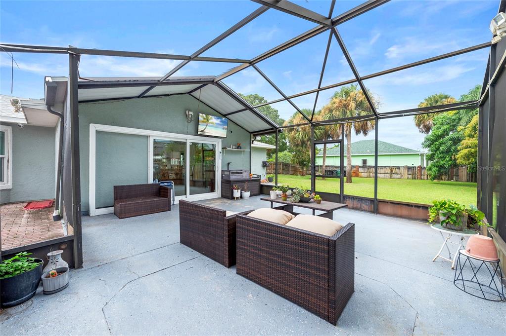 1041 Southwest General Patton Terrace Port St. Lucie, FL 34953 - Photo 25 of 39 a outdoor space with patio couches and pool view