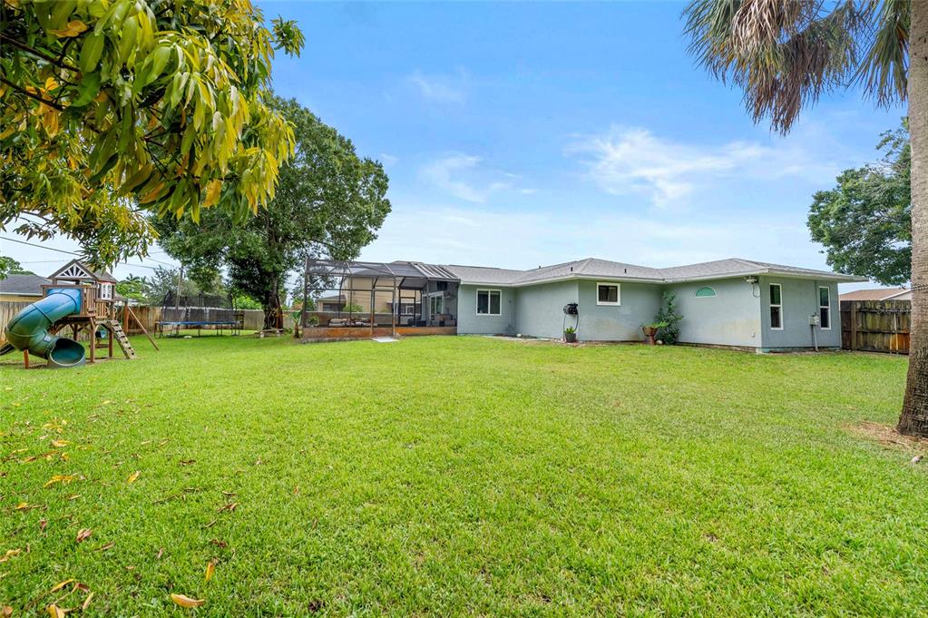 1041 Southwest General Patton Terrace Port St. Lucie, FL 34953 - Photo 26 of 39 a front view of house with a garden