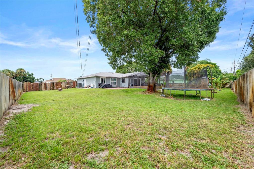 1041 Southwest General Patton Terrace Port St. Lucie, FL 34953 - Photo 28 of 39 a view of house with backyard