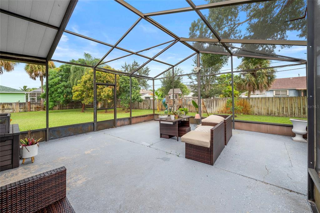 1041 Southwest General Patton Terrace Port St. Lucie, FL 34953 - Photo 29 of 39 a view of a porch with furniture and garden