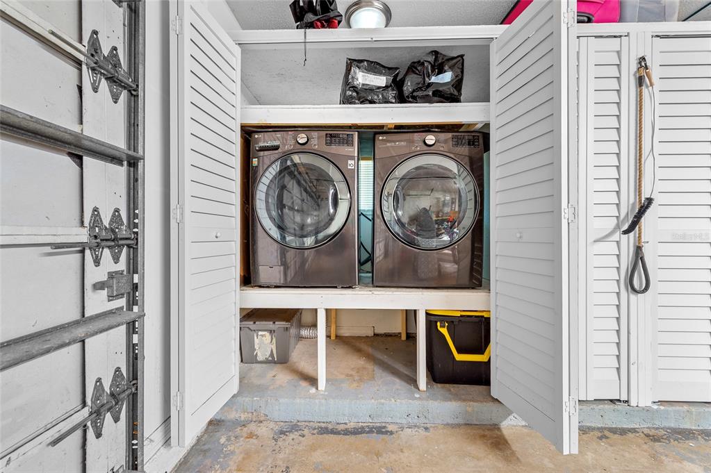 1041 Southwest General Patton Terrace Port St. Lucie, FL 34953 - Photo 31 of 39 a view of livingroom with washer and dryer