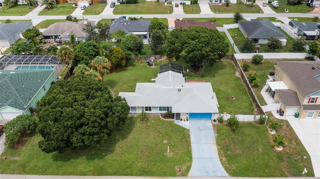 1041 Southwest General Patton Terrace Port St. Lucie, FL 34953 - Photo 32 of 39 an aerial view of a house with a garden