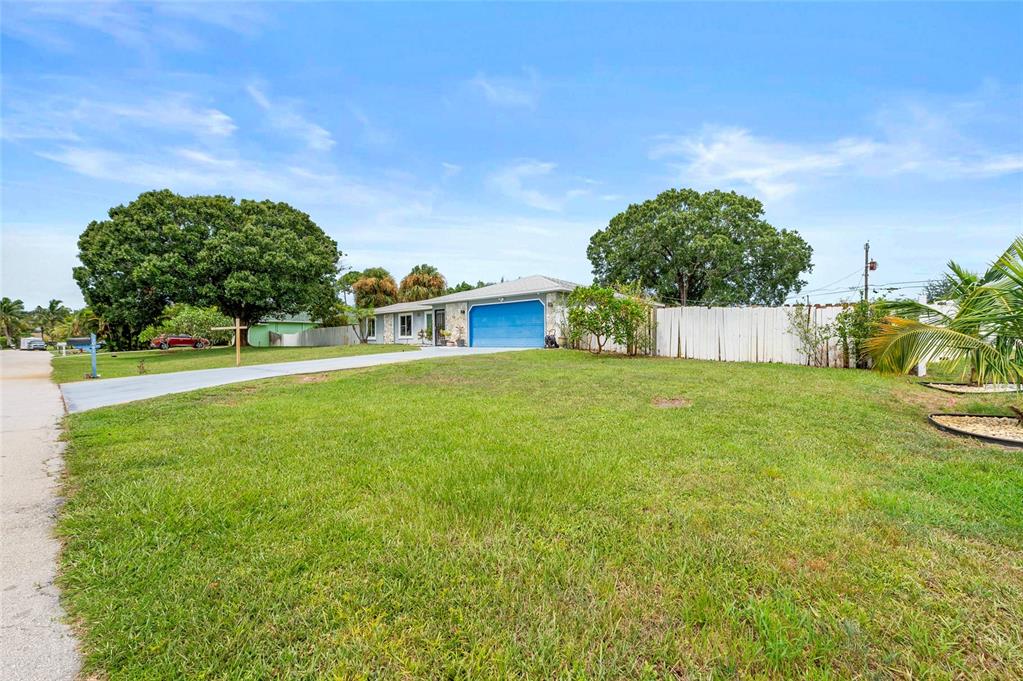 1041 Southwest General Patton Terrace Port St. Lucie, FL 34953 - Photo 38 of 39 a house view with swimming pool in front of it