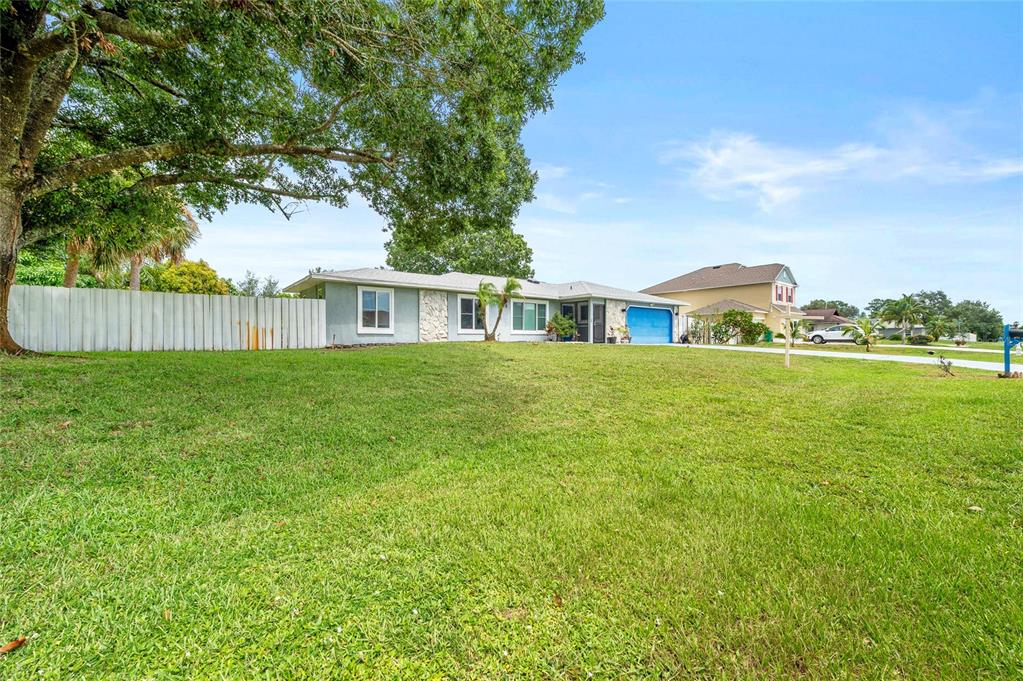 1041 Southwest General Patton Terrace Port St. Lucie, FL 34953 - Photo 39 of 39 a view of a house with a big yard