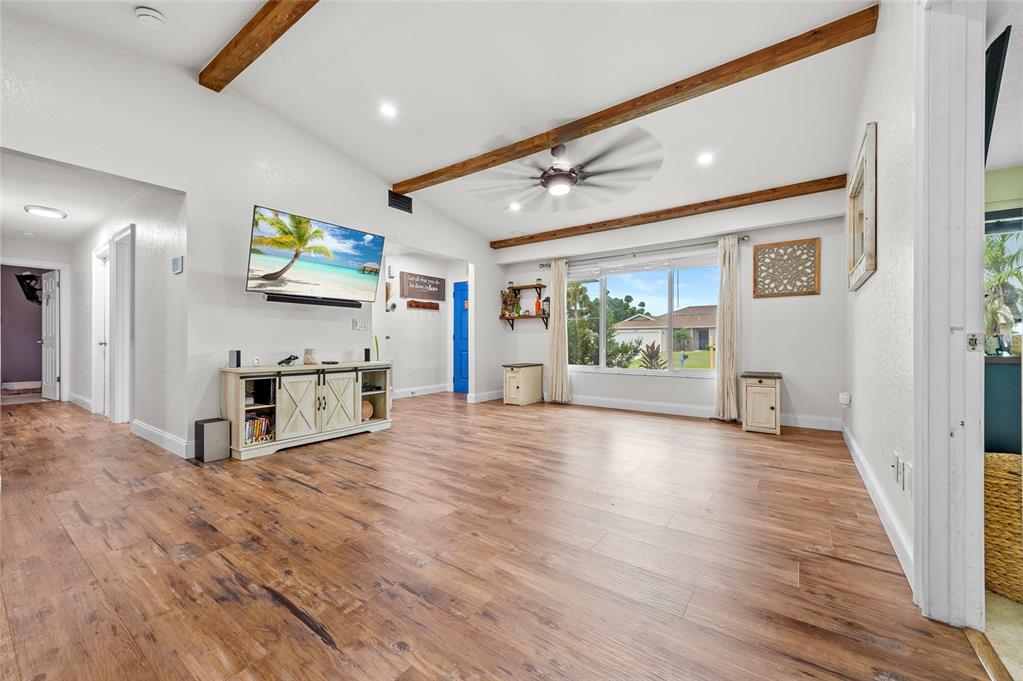 1041 Southwest General Patton Terrace Port St. Lucie, FL 34953 - Photo 6 of 39 a view of a kitchen with furniture and a window