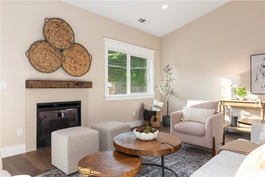 132 Burket Place Paso Robles, CA 93446 - Photo 10 of 30 a living room with furniture a window and a fireplace