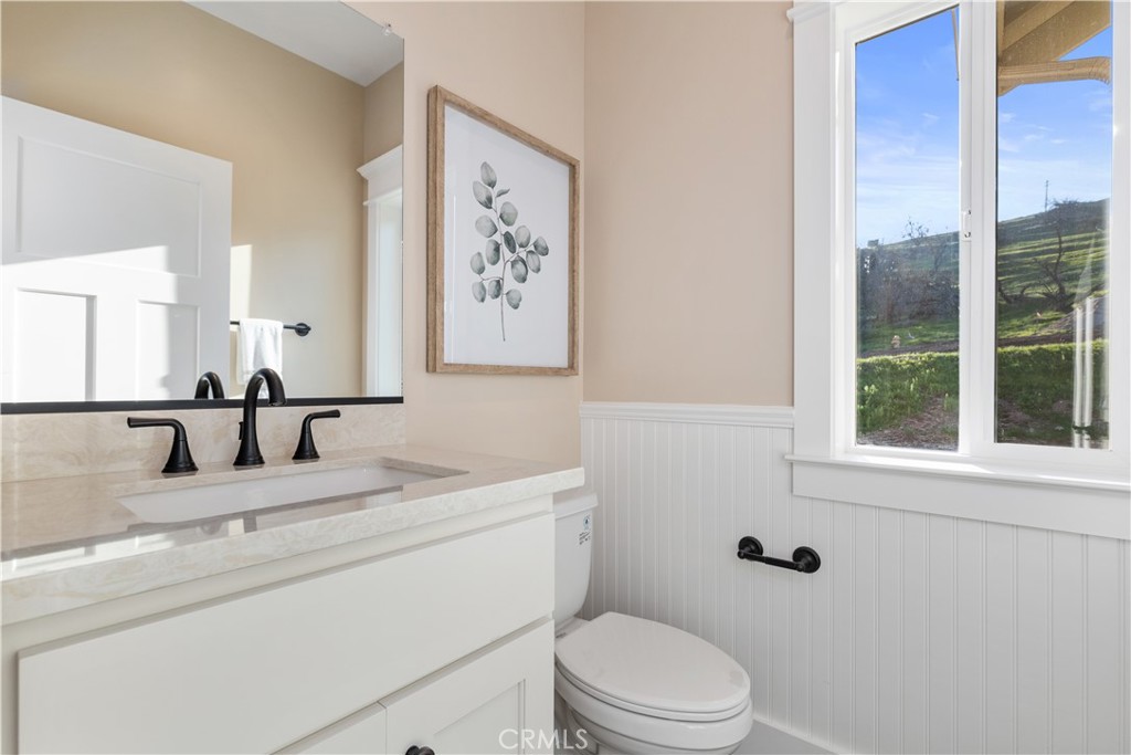 132 Burket Place Paso Robles, CA 93446 - Photo 14 of 30 a bathroom with a sink toilet and a mirror