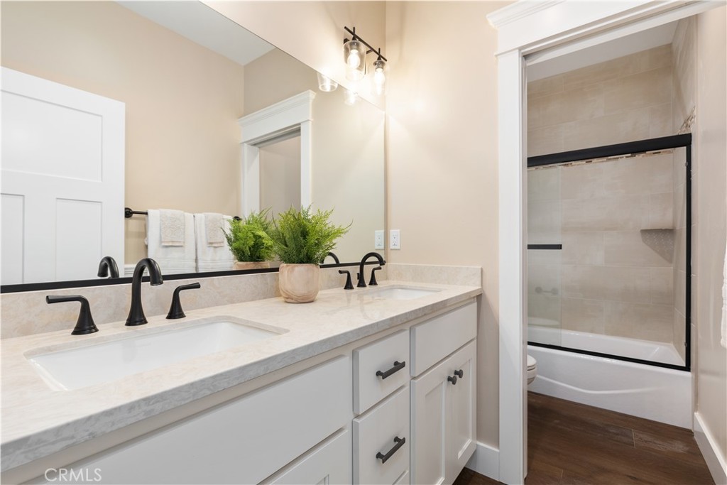 132 Burket Place Paso Robles, CA 93446 - Photo 19 of 30 a bathroom with a double vanity sink and mirror