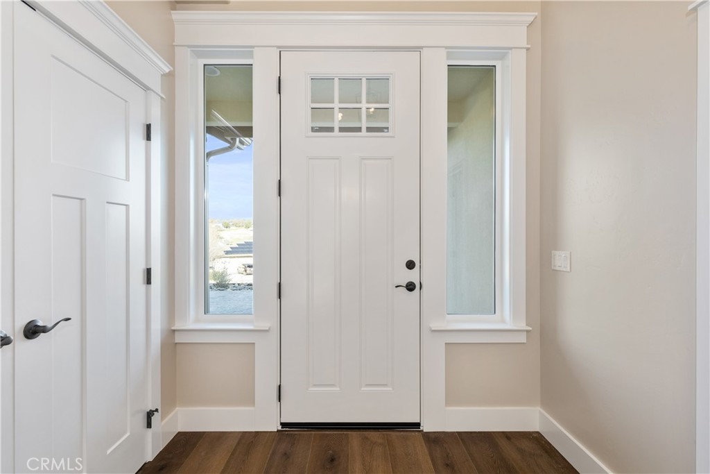 132 Burket Place Paso Robles, CA 93446 - Photo 3 of 30 an empty room with wooden floor and windows