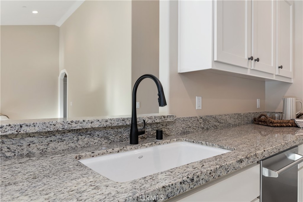 132 Burket Place Paso Robles, CA 93446 - Photo 6 of 30 a bathroom with a granite countertop sink and a granite top