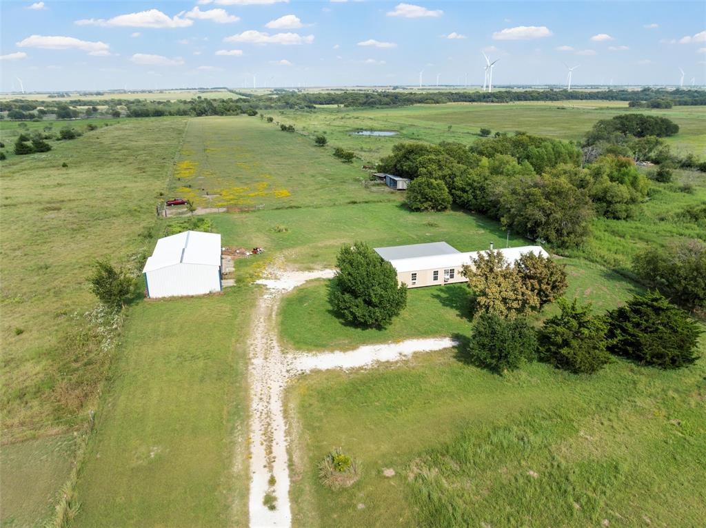 379 Neighbors Corner Road Mart, TX 76664 - Photo 11 of 15 a view of a lake with a building in the background