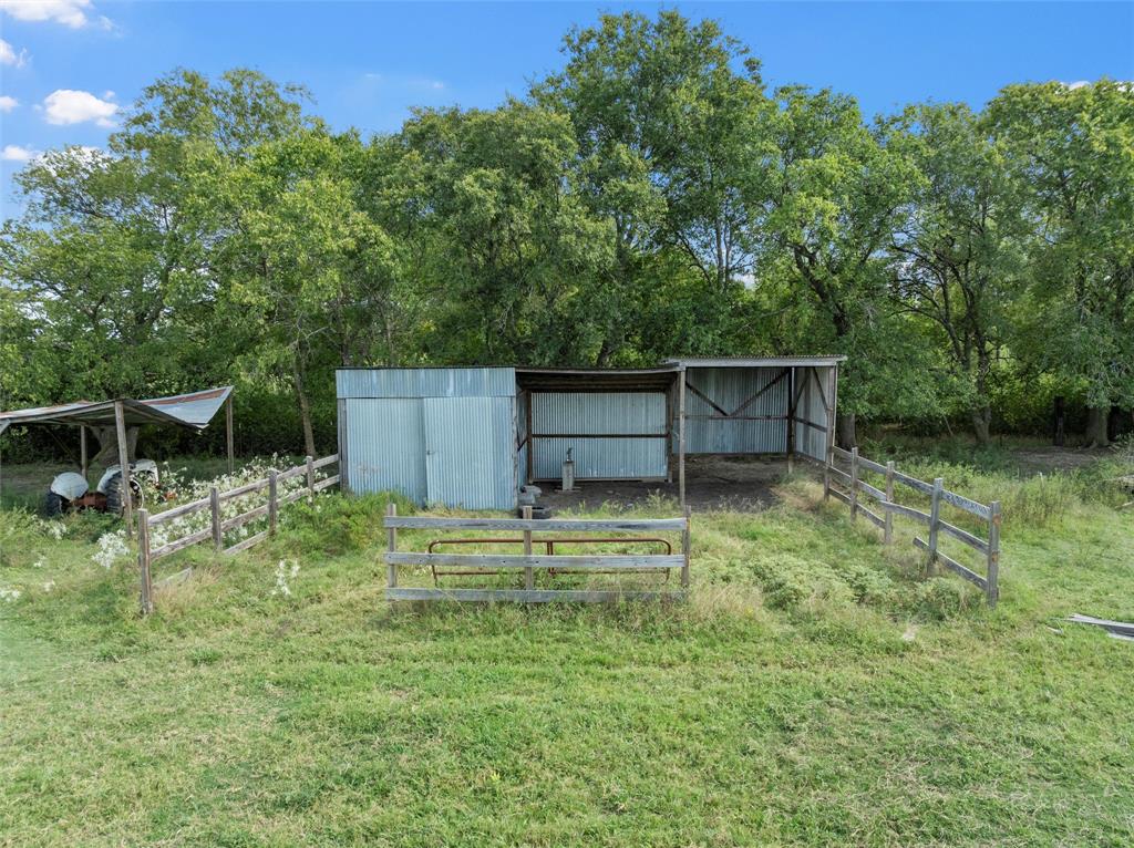 379 Neighbors Corner Road Mart, TX 76664 - Photo 7 of 15 a backyard of a house with table and chairs