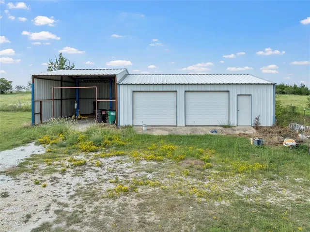 a front view of house with garden