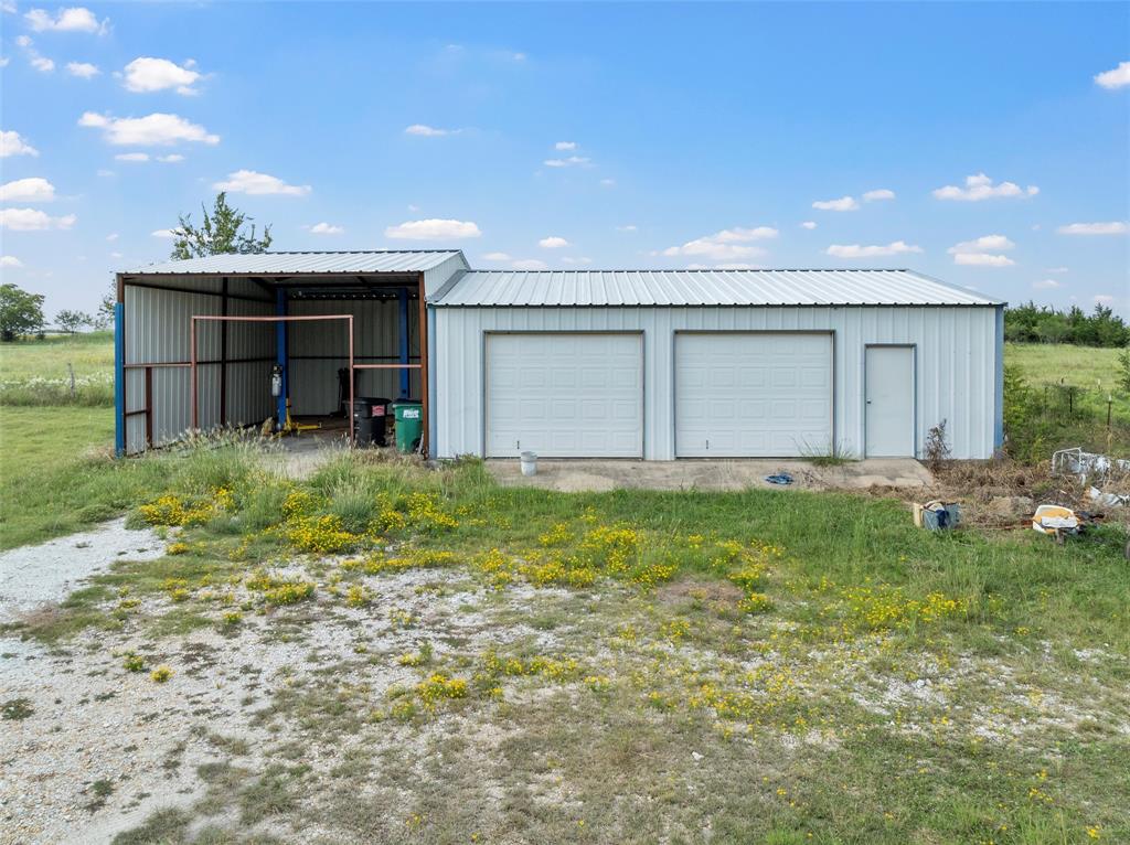 379 Neighbors Corner Road Mart, TX 76664 - Photo 9 of 15 a front view of house with garden