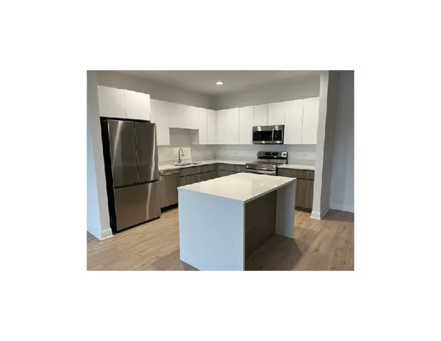 a view of a workspace with furniture