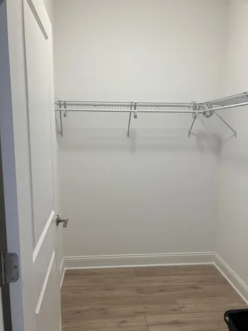 a bathroom with a sink a toilet a mirror and bathtub