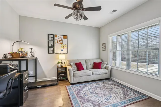 a living room with furniture and a rug