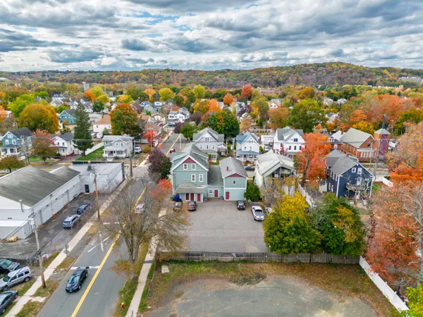 an aerial view of residential houses with outdoor space