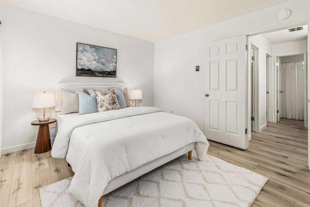 6780 Friars Road, Unit 129 San Diego, CA 92108 - Photo 15 of 50 a bedroom with a bed and a painting