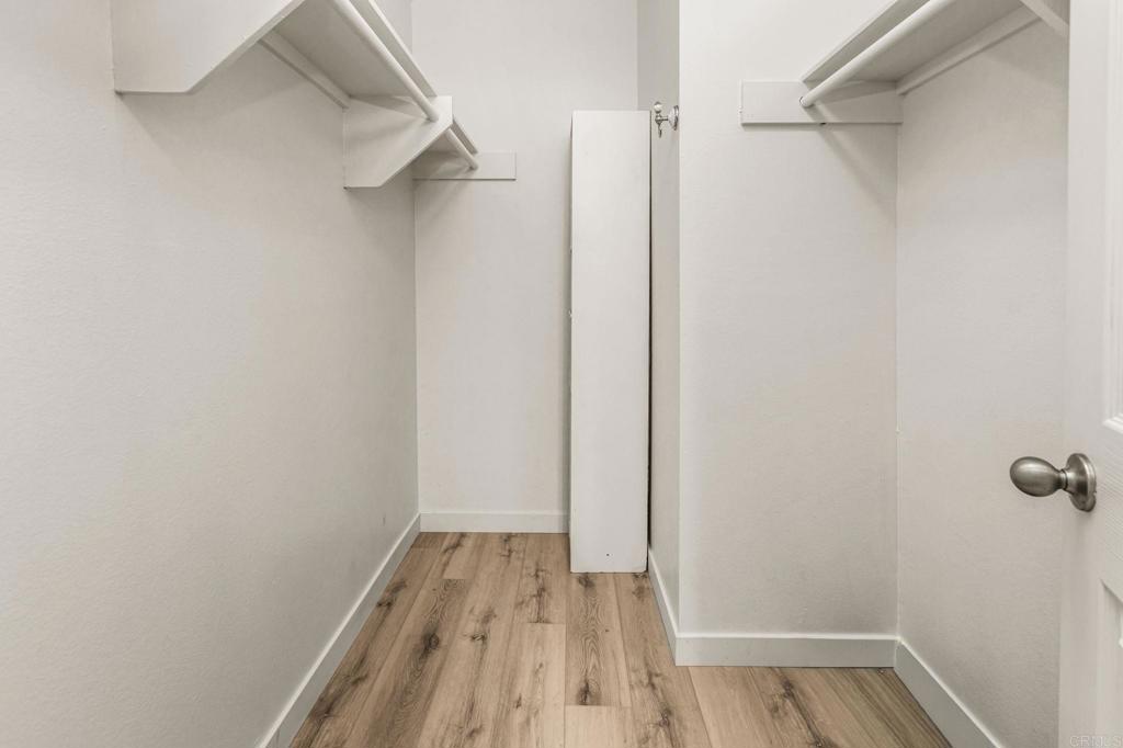 6780 Friars Road, Unit 129 San Diego, CA 92108 - Photo 17 of 50 a view of a room with wooden floor