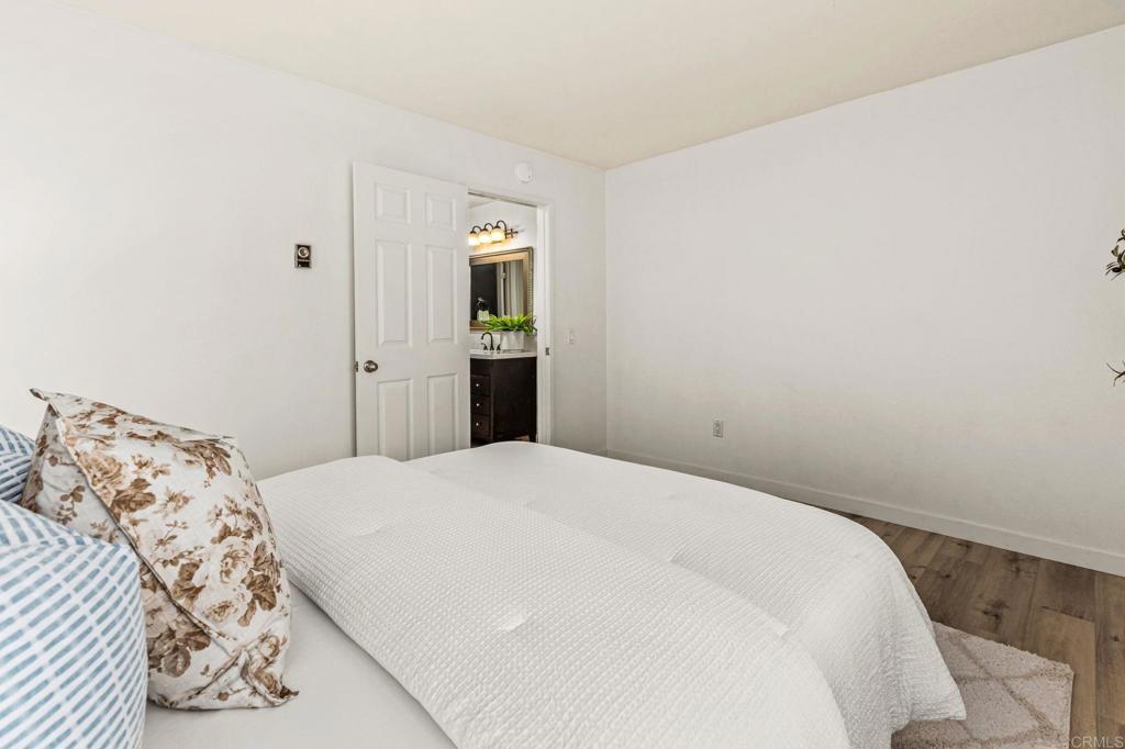 6780 Friars Road, Unit 129 San Diego, CA 92108 - Photo 18 of 50 a bedroom with a bed and a window