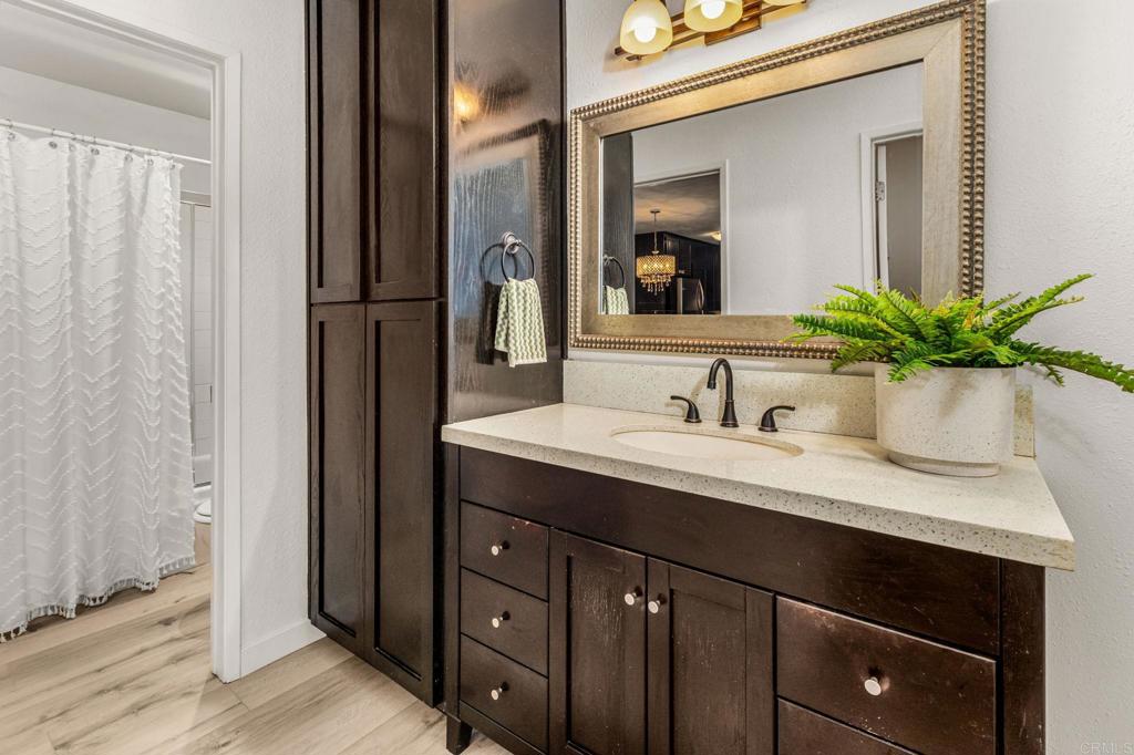6780 Friars Road, Unit 129 San Diego, CA 92108 - Photo 19 of 50 a bathroom with a sink and a mirror