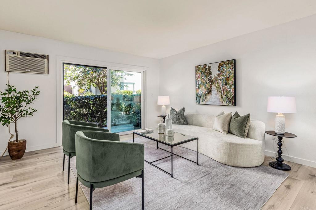 6780 Friars Road, Unit 129 San Diego, CA 92108 - Photo 2 of 50 a living room with furniture and a large window