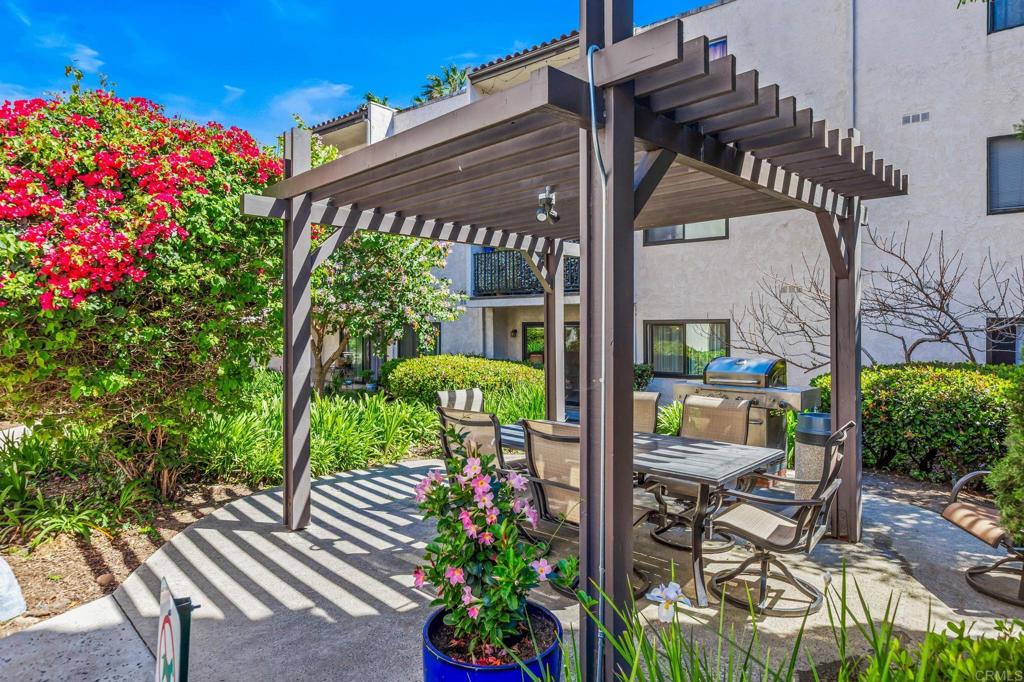 6780 Friars Road, Unit 129 San Diego, CA 92108 - Photo 24 of 50 a view of a chairs and table in a backyard